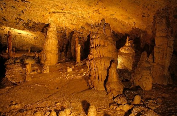 Underground columns in the hall of the largest caves of the Slovak Karst - Domica around town Plešivec